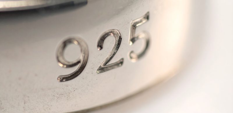 Firefly_Macro close-up photo of a 925 silver jewellery piece showing the engraved “925” hallm 168908